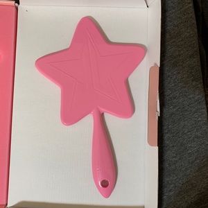 Pink Jeffree Star hand mirror